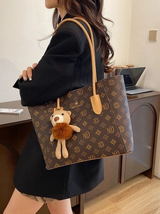 Retro monogram tote bag in dark brown leather with large capacity and bear charm accessory