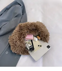Close-up of brown faux fur tote bag interior showing large capacity and daily storage