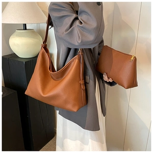 Brown lychee grain leather hobo bag with matching small zippered inner pouch and gold hardware