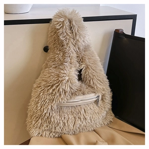 Detail of khaki plush tote bag showing soft faux fur texture and front zipper pocket
