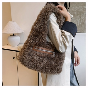 Detailed close-up of a brown fuzzy plush tote bag with a metal zipper front pocket