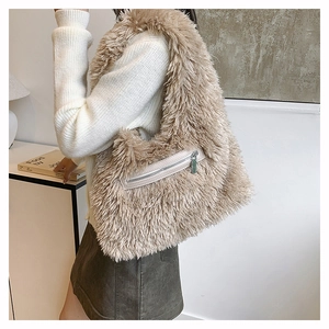 Detailed close-up of fuzzy faux fur shoulder bag with front zipper and plush texture