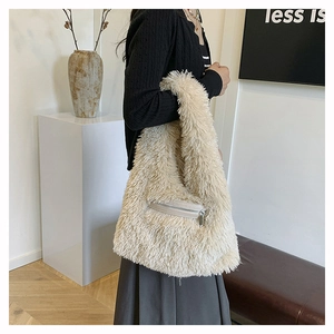 Close-up of fluffy plush shoulder bag with functional front metal zipper pocket detail