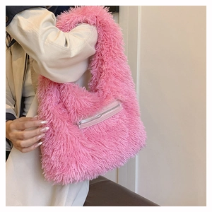 Detail of pink faux fur tote bag showing the soft texture and front zipper pocket detail