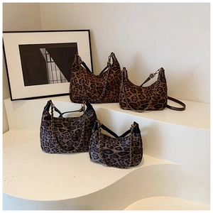 Leopard print shoulder bags in brown and gray tones with metal chain detail