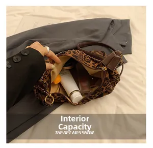 Leopard print handbag interior view showing large capacity for cosmetics and skincare products