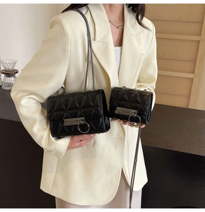 Detail showing standard and mini sizes of quilted black leather chain bags with metal buckles
