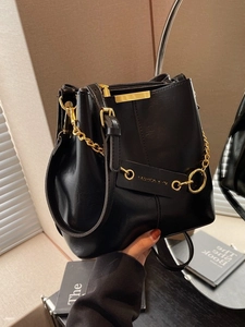 Classic black bucket bag for women with gold hardware and stylish chain details