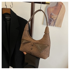 Détail du sac à bandoulière en tweed marron rétro avec col de costume et boutons