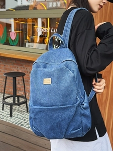 Vintage blue denim backpack for women with spacious main compartment and front pocket