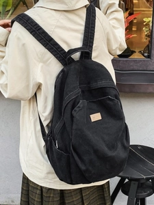 Fashionable black canvas backpack for women with large capacity and vintage denim style