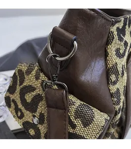 Detail of premium vintage leopard print tote bag featuring antique silver metal buckles