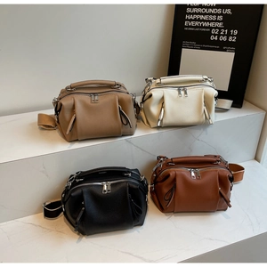 Macro detail of Boston bag collection in four colors with premium pebble leather texture