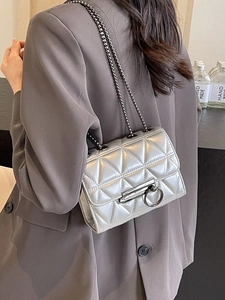 Silver quilted triangle pattern crossbody chain bag with metallic finish for women