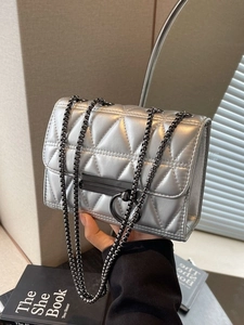 Silver quilted chain bag with black metallic ring clasp and hardware for women