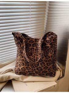 Large leopard print canvas tote bag for women showing a stylish shoulder bucket design