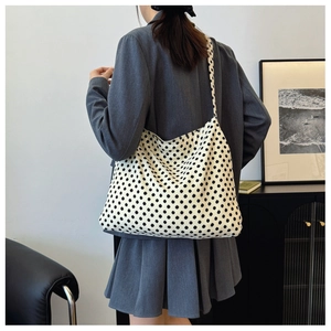 Polka dot canvas tote bag shown from behind, featuring large capacity and a wide shoulder strap