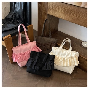 Detail showing ruffled canvas tote bags in four colors: pink, black, brown, and cream white