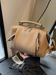 Premium tan pleated pillow bag for women featuring lychee grain leather and wide strap