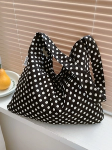 Polka dot canvas hobo bag with EMIS label displayed on a windowsill for a casual aesthetic