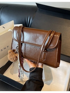 Retro dark brown oily leather shoulder bag with plush bear charm and silk scarf
