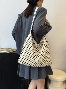 Minimalist white polka dot canvas tote bag with wide shoulder strap and spacious interior