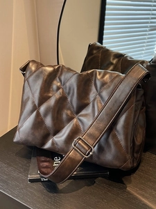 Chic dark brown quilted shoulder bag with rhombus patterns and a wide strap for women