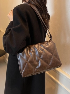 Deep brown quilted crossbody bag with oversized diamond pattern for women's daily commute