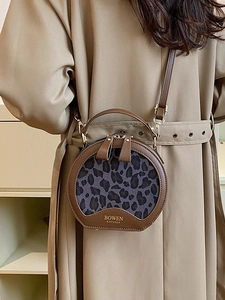 Retro round crossbody bag with leopard print panel and brown leather top handle strap