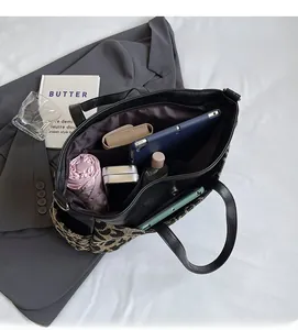 Top view of large tote bag interior showing spacious capacity for tablet and daily items