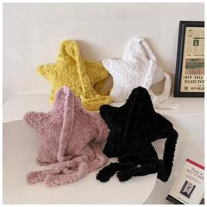 Close-up of plush star-shaped shoulder bags in yellow, white, pink, and black colors