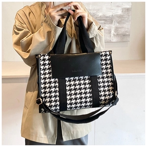 Classic houndstooth tote bag with leather flap shown on a model for daily styling
