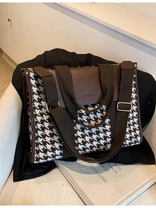 Vintage houndstooth tote bag with brown leather trim and wide adjustable shoulder strap