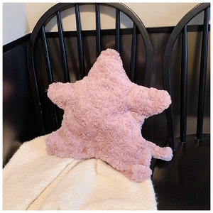 Close-up of pink star plush bag showing fluffy long-hair faux fur texture and soft detail
