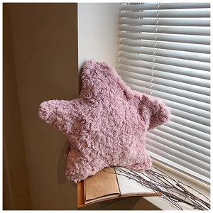 Detail of pink star plush bag showing soft fluffy faux fur texture in sunlight