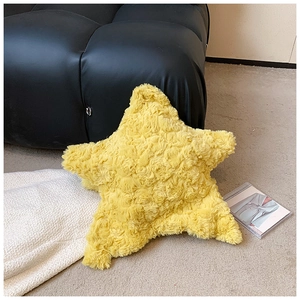 Detail of yellow plush star bag featuring textured rose curl faux fur material