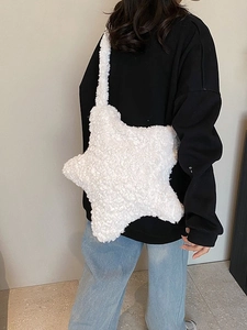 Plush star shaped shoulder bag in white faux fur with matching fluffy wide strap