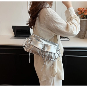 Silver metallic PU shoulder bag with multi-pocket design and drawstring details