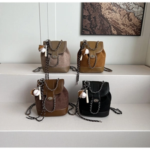 Detailed display of four mini leather chain backpacks in khaki, caramel, coffee, and black