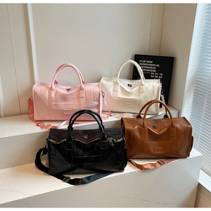 Bolsos de viaje de cuero PU impermeables en colores rosa, blanco, negro y marrón