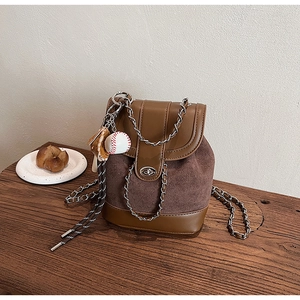 Retro brown frosted leather backpack with metal chain strap and baseball charm detail