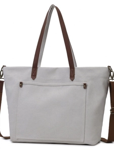 Versatile off-white canvas tote bag with brown leather handles and large front pocket