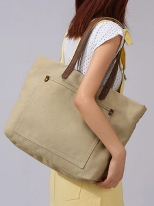 Large capacity canvas tote bag with brown leather handles and rivet detailing for women