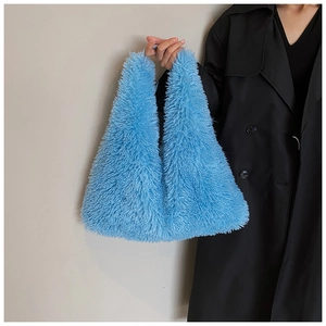 Close-up of fluffy sky blue faux fur tote bag showing soft texture and integrated handle