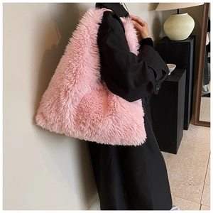 Detail of the soft pink plush faux fur texture on this large stylish tote bag