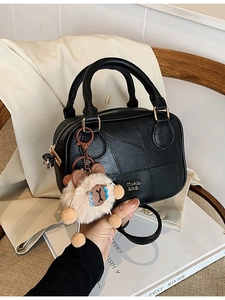 Retro black PU leather pillow bag with geometric stitching and plush animal charm