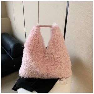 Close-up showing the soft pink plush texture and fuzzy material of this tote bag