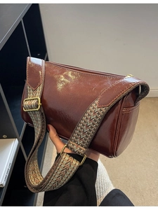 Vintage brown cylindrical crossbody pillow bag with bohemian geometric wide strap