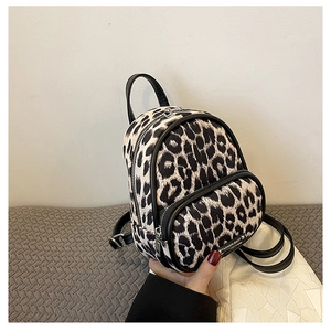 Detail of leopard print mini backpack with leather trim and FASHION BAGS label