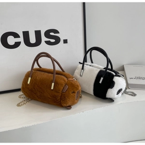 Detailed view of panda and capybara plush bags with leather handles and chain straps